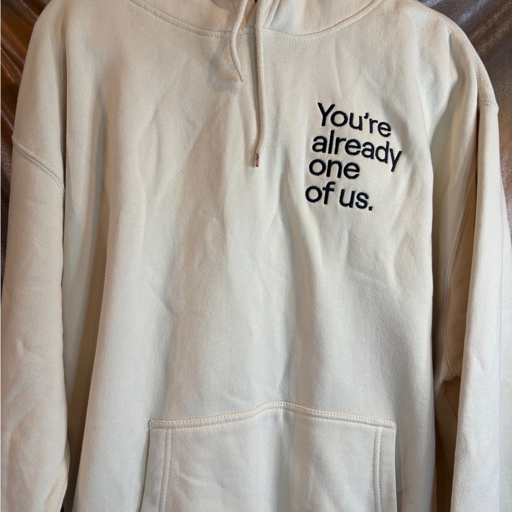New Twitch Cream Hoodie with Black Text “you’re already one‎ of us” 500
